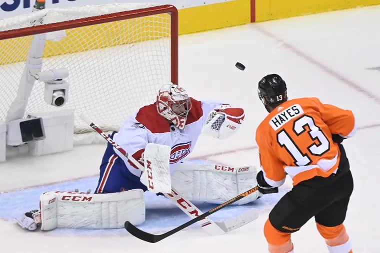 Canadiens goaltender Carey Price (31) makes a glove save on Flyers center Kevin Hayes (13) during Montreal's 5-3 victory Wednesday night.