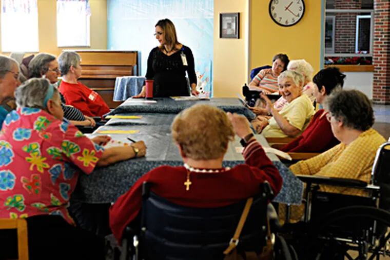 Buttonwood administrator Eve Cullinan with the residents' council. (Tom Gralish / Staff Photographer)