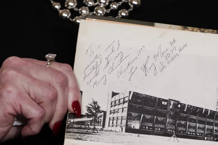 Beverly Young Nelson shows her high school yearbook, allegedly signed by Roy Moore, at a news conference in New York on Monday, Nov. 13, 2017.