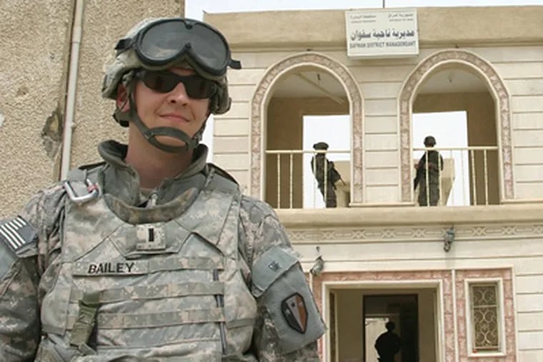 First Lt. Ryan Bailey provides external security for a meeting in the Safwan, Iraq mayor's office while the soldiers assigned to his protective security detail provide internal security in early May. (Photo courtesy Maj. Jason Fetterolf)