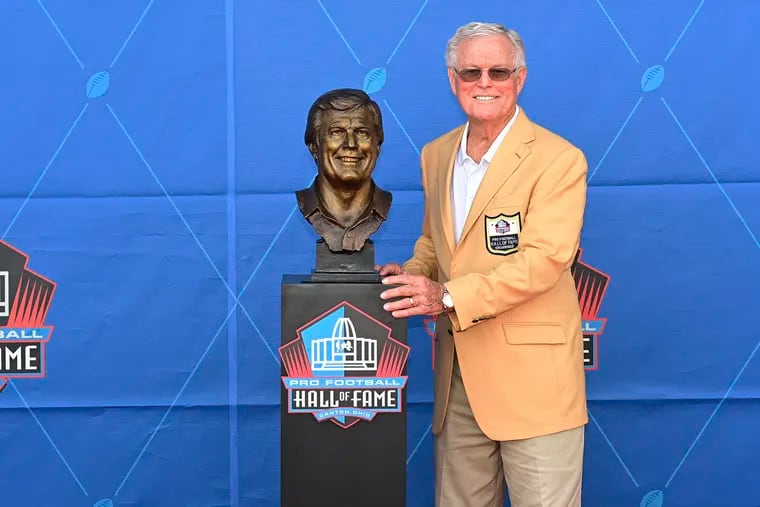 Former NFL coach Dick Vermeil with his bust during an induction ceremony at the Pro Football Hall of Fame in Canton, Ohio.