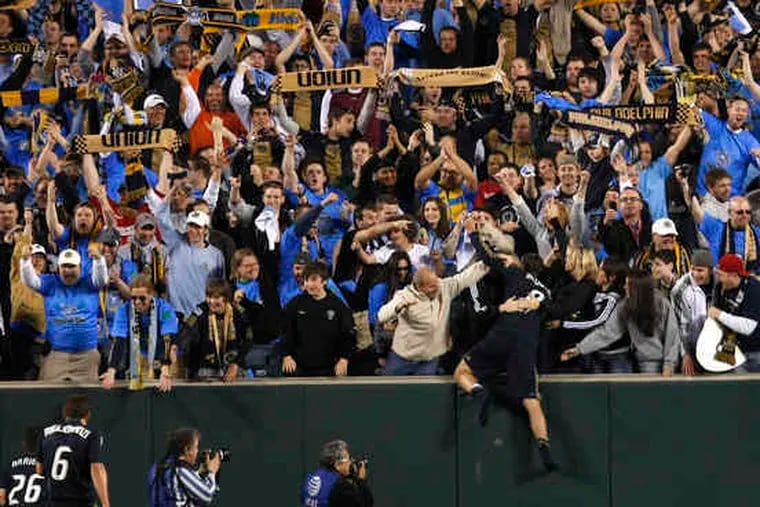 Jubilant at their 3-2 victory over D.C. United, some members of the Philadelphia Union leap into the stands to celebrate with fans at Lincoln Financial Field. The team's first game at its new home, PPL Park in Chester, is scheduled for June 27, against the Seattle Sounders.