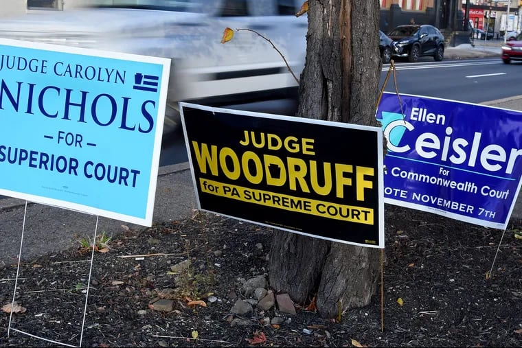 Signs for judicial candidates Carolyn H. Nichols (from left), Dwayne D. Woodruff and Ellen H. Ceisler are posted along Spring Garden Street November 6, 2017. TOM GRALISH / Staff Photographer