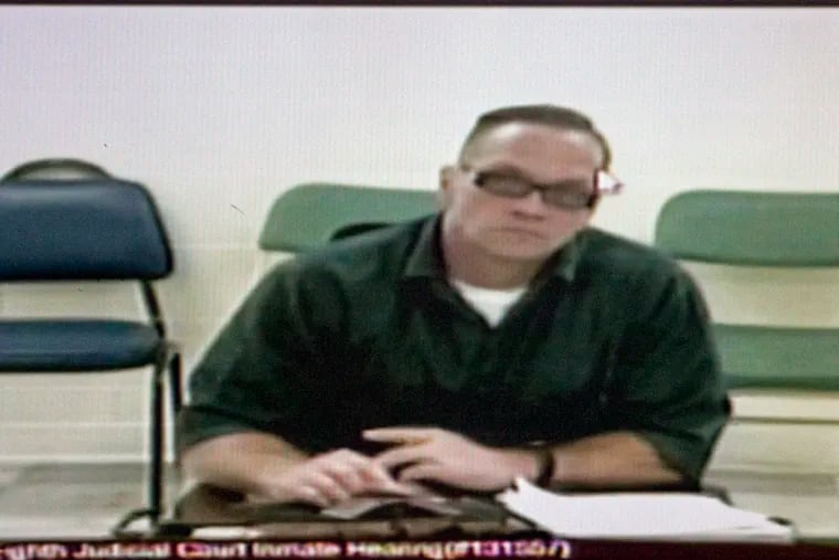 FILE - In this Dec. 5, 2017, file photo, Nevada death row inmate Scott Dozier appears for his court hearing via video at the Regional Justice Center in Las Vegas. Nevada prison officials say death row inmate Dozier has gone to great lengths to try to kill himself while awaiting execution, including attempting to obtain a fatal drop of a deadly drug on a piece of paper sent through prison mail. (Erik Verduzco/Las Vegas Review-Journal via AP)