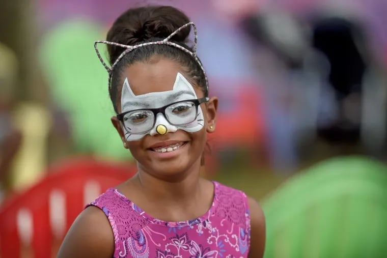 Madison Crippen, 8, with freshly painted face on the opening weekend of the Ben Franklin Parkway’s Oval+.