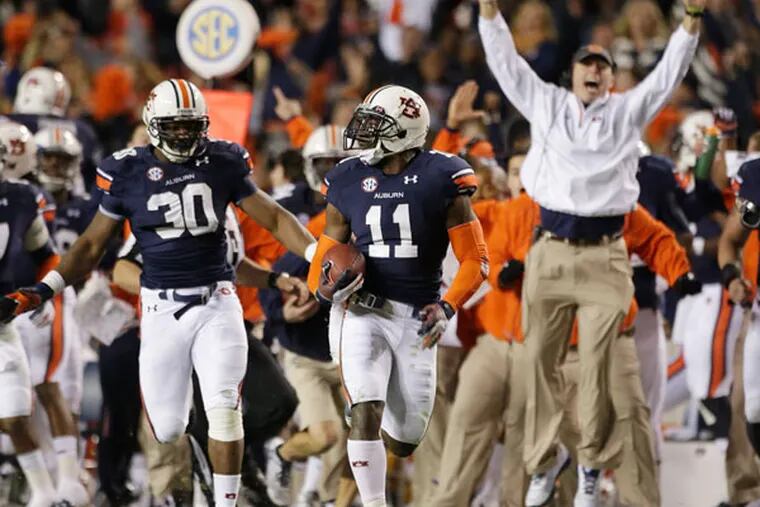Auburn cornerback Chris Davis (11) returns a missed field-goal attempt 100-plus yards to score the game-winning touchdown as time expired in the fourth quarter of an NCAA college football game against No. 1 Alabama in Auburn, Ala., Saturday, Nov. 30, 2013. Auburn won 34-28. (Dave Martin/AP)