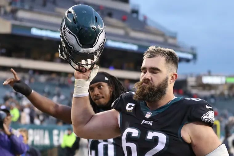 Eagles center Jason Kelce (62) raises his helmet to acknowledge the home crowd after a 40-29 win over the New Orleans Saints at Lincoln Financial Field back on Nov. 21, 2021. Kelce has pondered retirement the past several seasons, but is still finding reasons to come back and play.