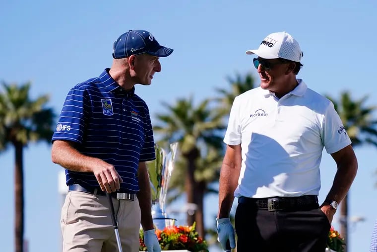 Jim Furyk (left) and Phil Mickelson talk at the Charles Schwab Cup Championship last November in Phoenix.