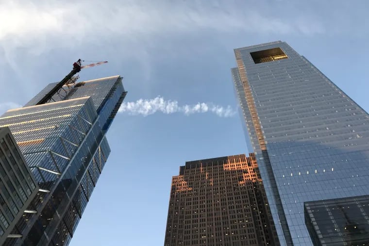 The new Comcast tower, on the left, is now taller than the Comcast Center.