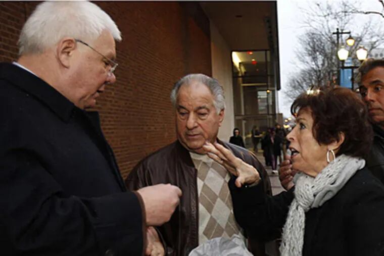 DAVID MAIALETTI / STAFF PHOTOGRAPHER Edwin Jacobs Jr. (left), lawyer for reputed mob boss Joseph Ligambi, speaks with Ligambi's brother Philip and the mother of former consigliere George Borgesi after the verdicts were read Tuesday.