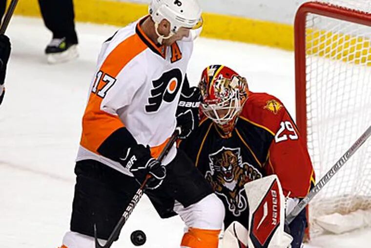 Florida Panthers goalie Tomas Vokoun blocks a shot by Jeff Carter, who scored twice for the Flyers. (AP Photo)