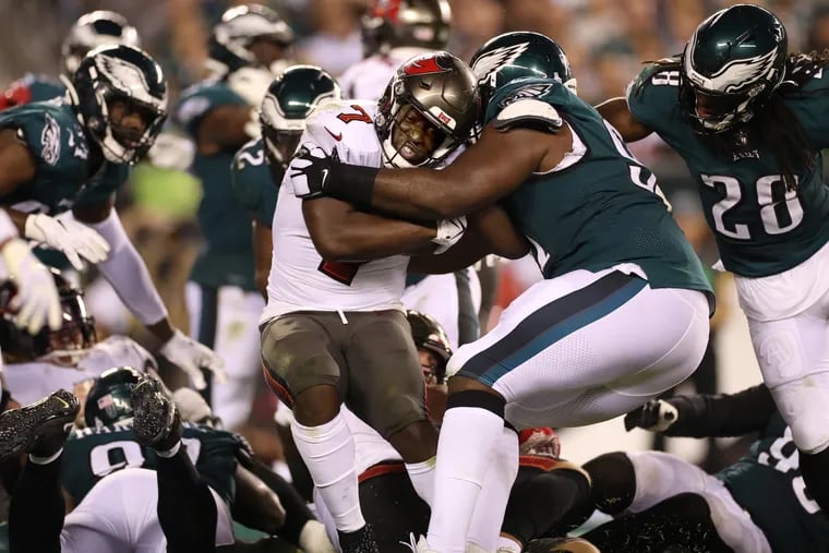 Eagles tackle Fletcher Cox  tackling Tampa Bay's Leonard Fournette during their game on Oct. 14.