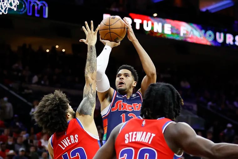 Tobias Harris shoots the basketball against Detroit Pistons forward Isaiah Livers and center Isaiah Stewart in the Sixers' regular-season finale.