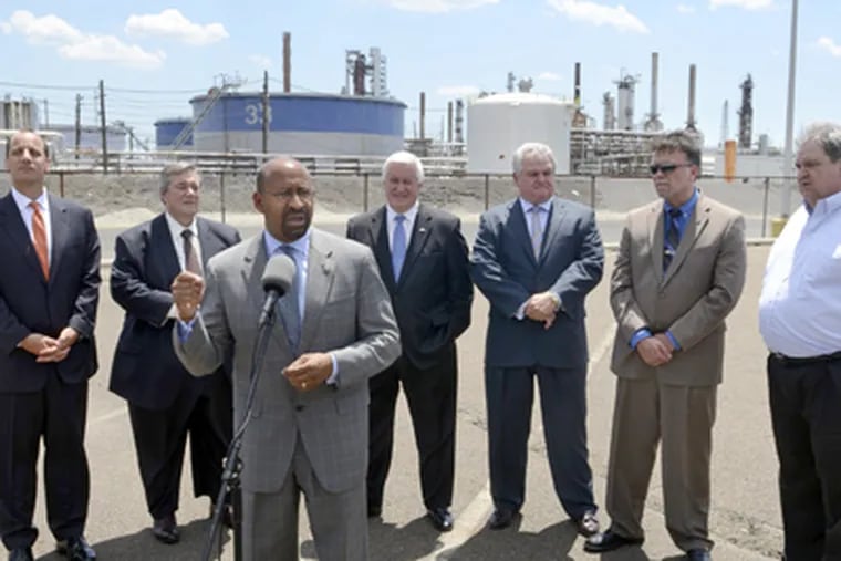 Mayor Michael Nutter speaks during press conference outside Sunoco's Philadelphia refinery on Passyunk Avenue July 2, 2012. Behind him (from left) are David Marchick, Managing Director, The Carlyle Group; Philip Rinaldi, chief executive of Philadelphia
Energy Resources; Governor Tom Corbett; U.S. Representative Robert Brady; Jim Savage Local 10-1, United Steelworkers; and Tom Conway, International Vice President, United Steelworkers Union.  (Tom Gralish / Staff Photographer)