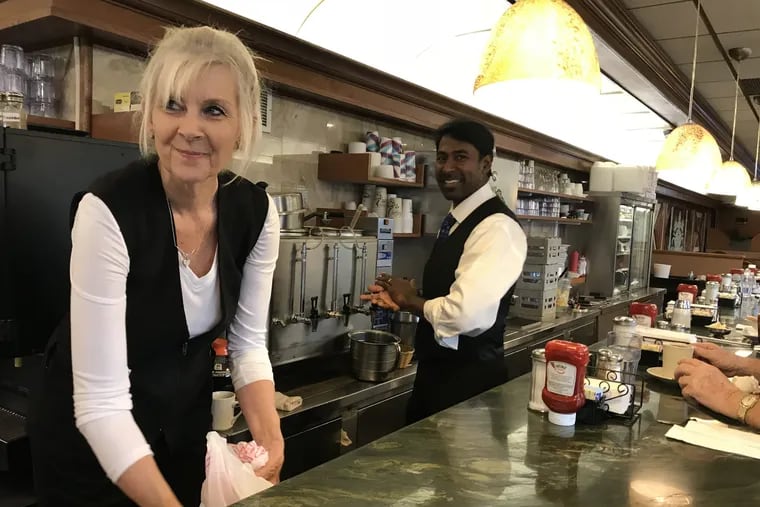 Janice Chmielinski works the counter at at Suburban Diner in Feasterville, Pa., on Tuesday, Nov. 24, 2018. President Trump still draws positive chatter among customers to the suburban Philadelphia diner, even heading into the 2018 midterm elections.