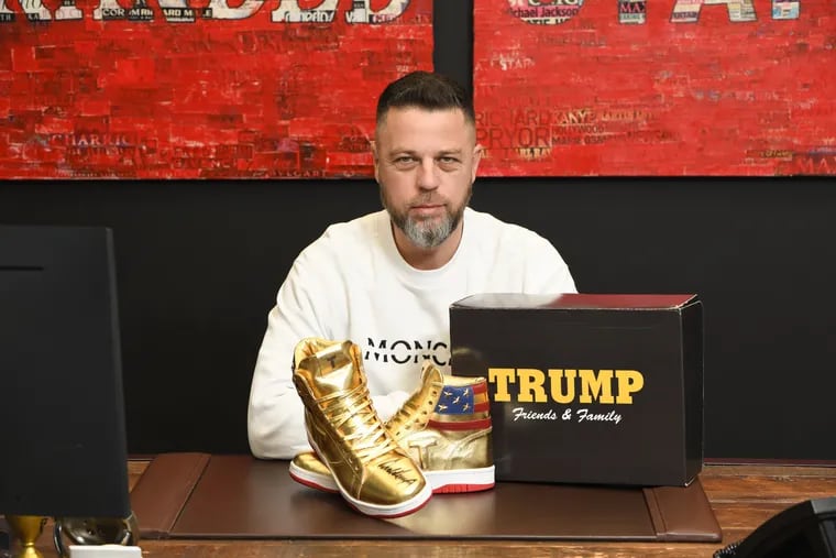 Bucks County resident Roman Sharf poses with his autographed Donald Trump sneakers.