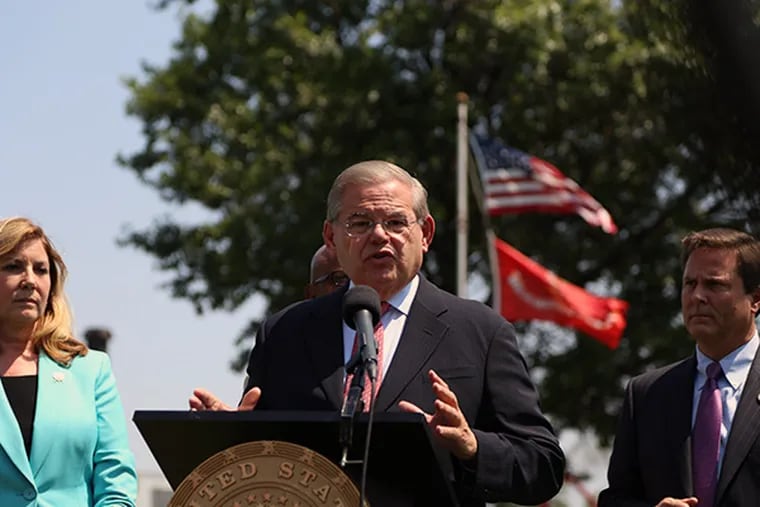 U.S. Senator Robert Menendez speaks during a press conference in Paulsboro, New Jersey on Thursday, August 7th, 2014. Menendez outlined new legislation in response to last week's National Transportation Safety Board findings in the 2012 Paulsboro train derailment.  (Andrew Thayer / Staff Photographer)