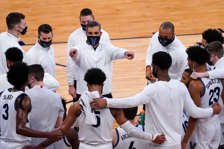 Villanova head coach Jay Wright, center, gives his team instruction against Georgetown in the quarterfinals of the Big East tournament last Thursday.
