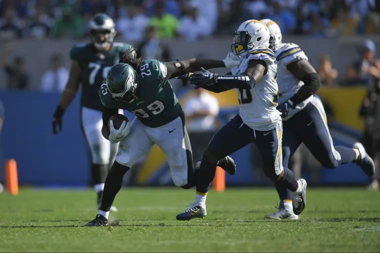 Running back LeGarrette Blount gets a hand on the facemask of Chargers defensive back Desmond King on a run during the Eagles’ 26-24 win on Sunday.
