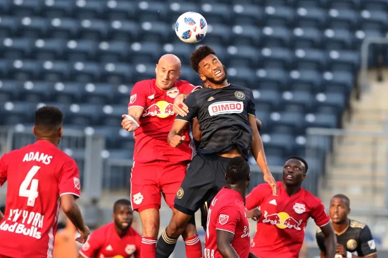 Philadelphia Union defender Auston Trusty goes up for a header against New York Red Bulls defender Aurelien Collin during the teams' U.S. Open Cup round of 16 game at Talen Energy Stadium.