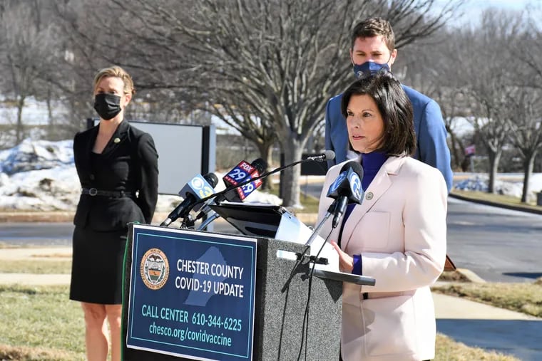 Chester County Board of Commissioners Chair Marian Moskowitz, at podium, asked Pennsylvania health officials to send more COVID-19 vaccine at a Feb. 25, 2021 press conference in West Chester, Pa., with fellow commissioners Josh Maxwell and Michelle Kichline.