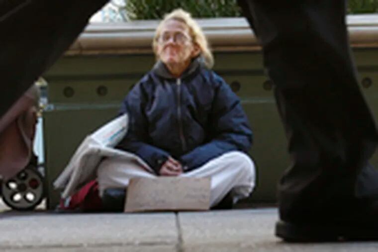 In Philadelphia, Yolanda Radzewicz begs on Market Street near Eighth. Homeless since 2000, she&#0039;d like to get off the streets but resists shelters.