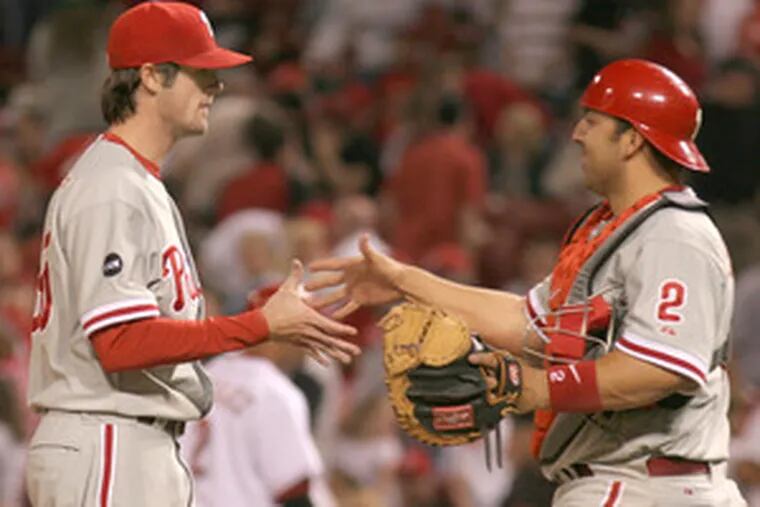 Phillies pitcher Cole Hamels is congratulated by catcher Rod Barajas after his dominating performance against Cincinnati.