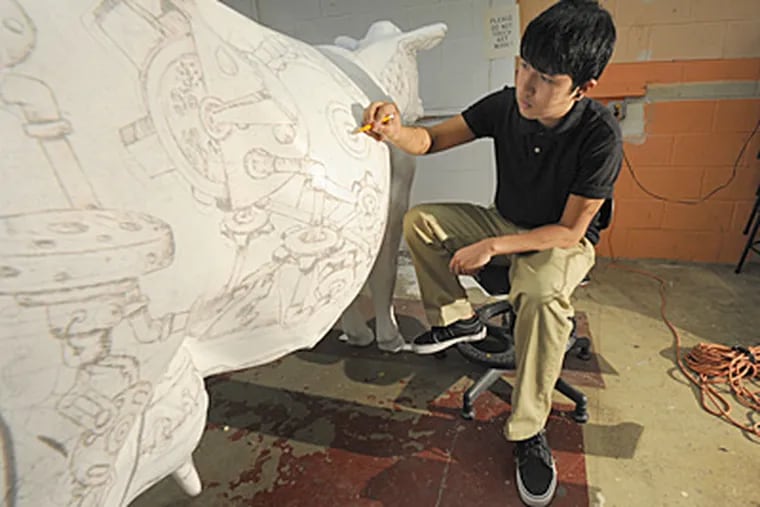 Overbrook sophomore Gustavo Ramirez works on his entry for the Lucerne Art of Dairy Contest. (April Saul / Staff Photographer)