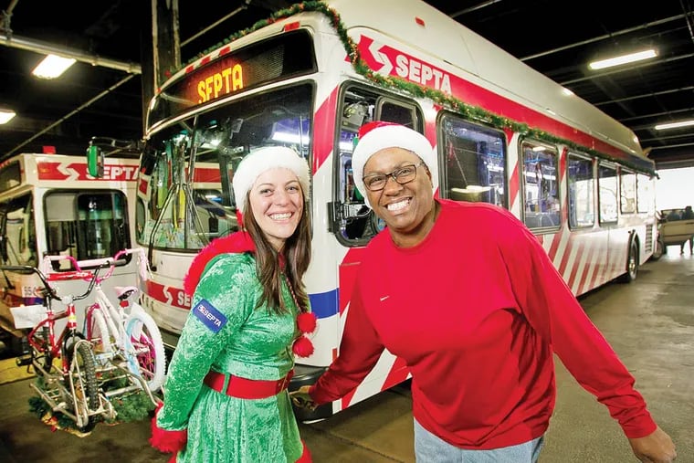 Dennies Scott (left) and Ada Williams bus drivers with SEPTA decorated the Christmas bus for the transit agency.