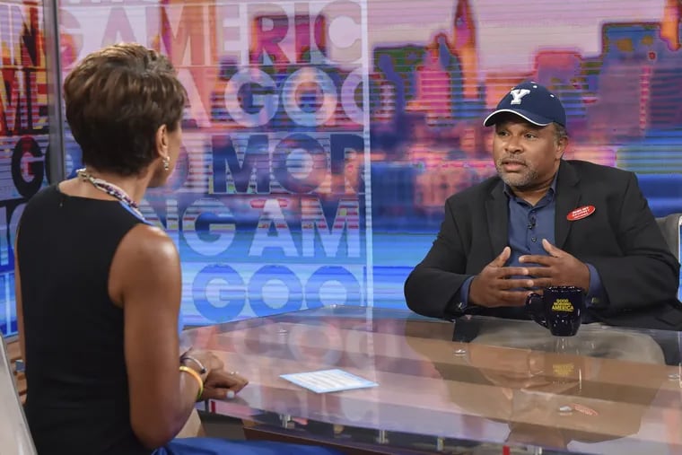 This image released by ABC shows co-host Robin Roberts, left, with "The Cosby Show"  actor Geoffrey Owens during an interview on "Good Morning America" on Tuesday, Sept. 4, 2018. Owens says he's thankful for the support he has received since photos of him working a regular job at a grocery store showed up on news sites.