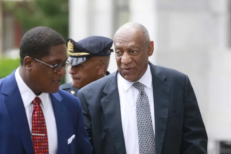 Bill Cosby walks into Montgomery County Courthouse with his spokesman, Andrew Wyatt, for the fifth day of jury deliberations.