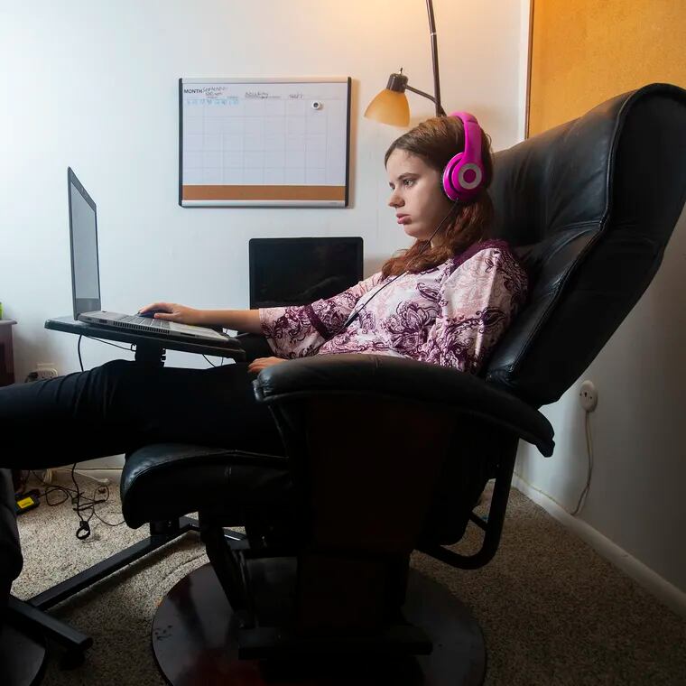 Jessica Anderson, 14, does work while attending a cyber charter school from her Downingtown home in 2020. While there are benefits to online learning, watchdogs have been flagging wasteful spending and poor oversight of state cyber schools for more than a decade.