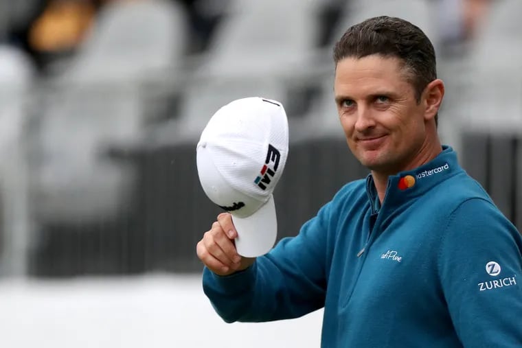 Justin Rose is the leader by one stroke going into the final round of the 2018 BMW Championship at the Aronimink Golf Club in Newtown Square, PA on Sept. 8, 2018.  He tips his hat to the crowd after finishing.