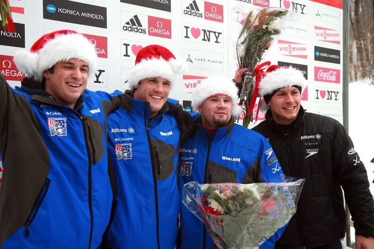 After winning the silver medal, the USA 1 four-man bobsled team poses during the flower ceremony at the Four Man Bobsled World Cup, Sunday, Dec. 16, 2007 in Lake Placid, N.Y. From left to right: Steve Mesler, brakeman Brock Kreitzburg, driver Steve Holcomb, and Pavle Jovanovic. Jovanovic died late last week. He was 43.