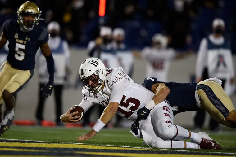 Temple quarterback Anthony Russo scores a touchdown as he is dragged down by Navy's Kevin Brennan during the second half.