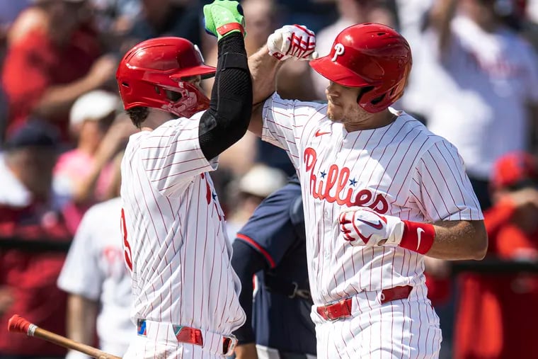 Phillies’ J.T. Realmuto is congratulated by Bryce Harper after a solo home run during the first inning against the Atlanta Braves on Wednesday, Feb 28, 2024 at BayCare Ballpark in Clearwater, FL.