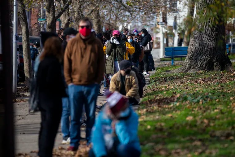 People wait in a line wrapping around Mifflin Square Park for COVID-19 testing with Philadelphia Flight and SEAMAAC in South Philadelphia, Pa., on Thursday, Nov. 19, 2020.