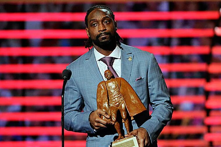 The Bears' Charles Tillman accepts the award for Walter Payton NFL Man of the Year. (Evan Agostini/Invision for NFL/AP Images)