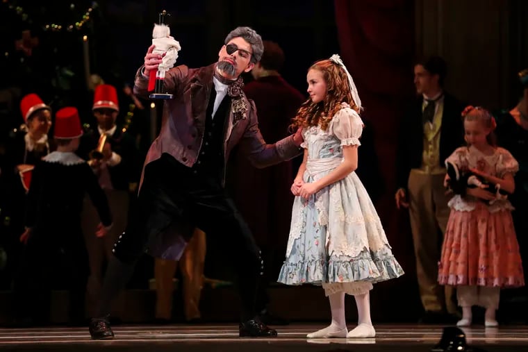 Sterling Baca performs as Herr Drosselmeier with Ellie Sidlow, as Marie, during dress rehearsal for the Philadelphia Ballet's Nutcracker at the Academy of Music last month.