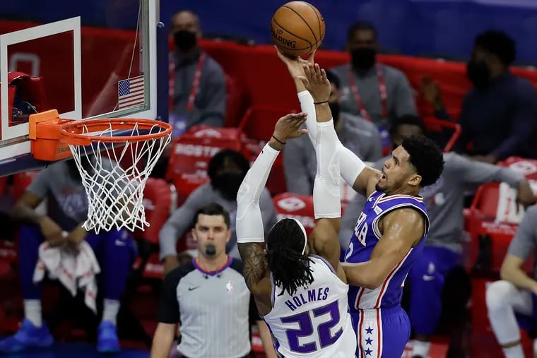 Sixers forward Tobias Harris tosses a lay up over Sacramento's Richaun Holmes during the second quarter on Saturday, March 20, 2021. Harris finished with 29 points, 11 rebounds and eight assists.