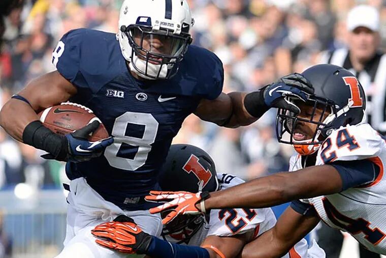Penn State's Allen Robinson (6) tries to elude Illinois defenders Zane Petty (21) and Darius Mosely (24) in the first quarter of an NCAA college football game against Illinois in State College, Pa., Saturday, Nov. 2, 2013. (AP Photo/John Beale)