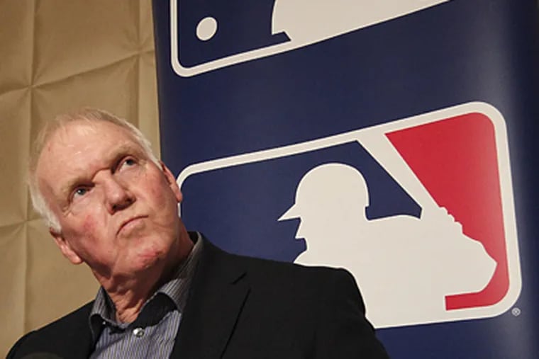 Phillies manager Charlie Manuel listens to a reporter's question during the Winter Meetings on Tuesday.  (LM Otero/AP Photo)