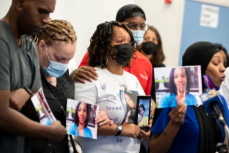 Shana Fletcher (center) tears up as Jean Washington-Fletcher speaks about Tiffany Fletcher during the District Attorney’s weekly press conference on Monday. Tiffany Fletcher was killed outside of the Mill Creek Recreation Center at 47th and Brown Streets on Friday.