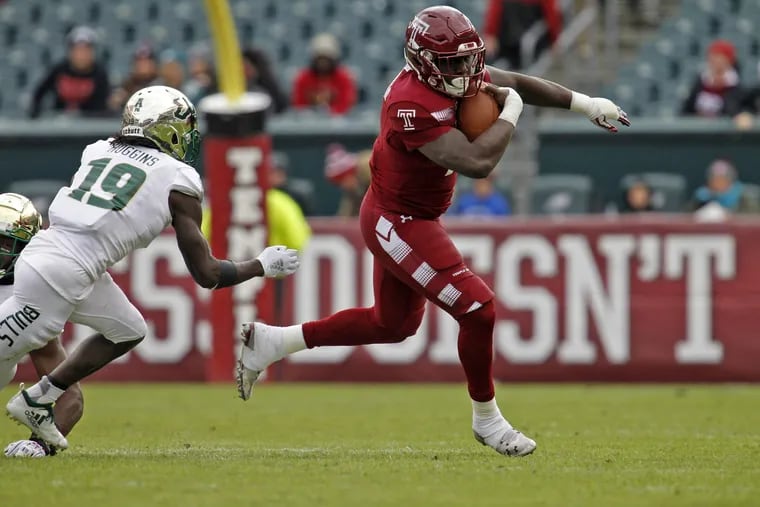 South Florida's Ronnie Hoggins (19) defends as Temple's Ryquell Armstead right runs the ball upfield during a college football game, Saturday Nov. 17, 2018 in Philadelphia, Pa. ( H. Rumph Jr / For the Inquirer )