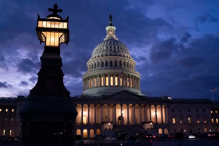 Night falls at the the Capitol in Washington on Thursday.