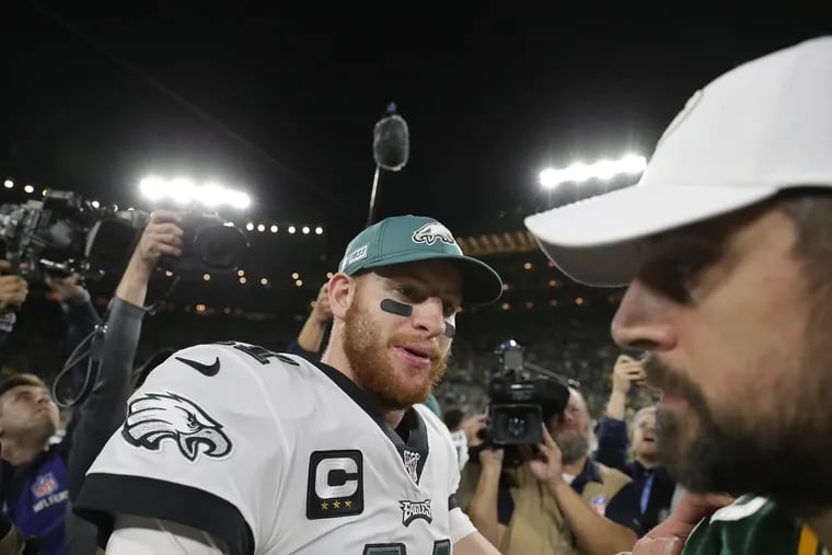 Eagles QB Carson Wentz and Packers QB Aaron Rodgers met after Philadelphia's 34-27 win over Green Bay last season.