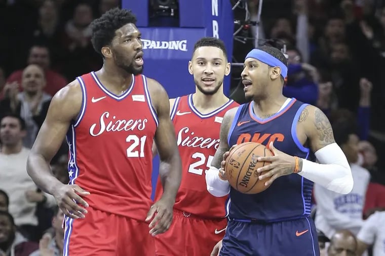 Sixers center Joel Embiid (left) has words with Thunder forward Carmelo Anthony (center) with Ben Simmons in the middle during the third quarter of the Sixers’ triple-overtime loss to the Thunder.