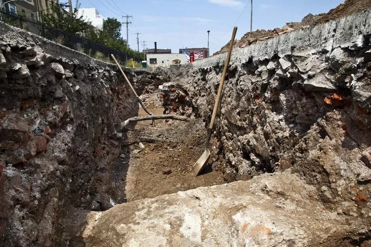 A large trench dug during a 2012 excavation in a parking lot at Columbus Boulevard and Vine Street shows walls believed to be from the 19th-century West Shipyard. ELISE WRABETZ / Staff Photographer