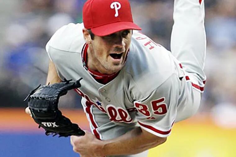 Cole Hamels allowed four runs on seven hits and struck out seven on Thursday against the Mets. (Frank Franklin II/AP)