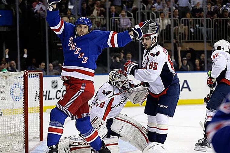 Rangers winger Ryane Clowe celebrates a goal by Carl Hagelin in the second period. (Kathy Willens/AP)